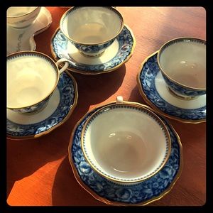 Chippendale tea cups with saucers.